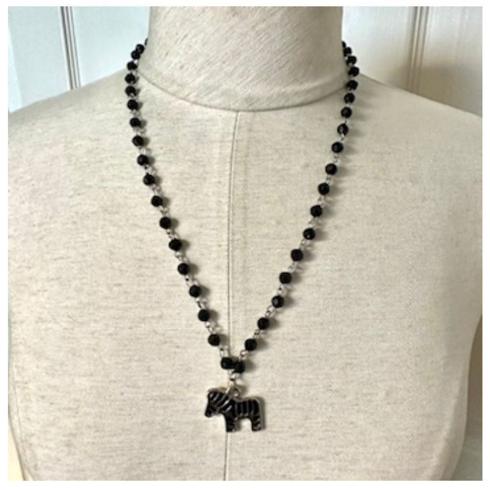Silver tone black beaded zebra pendant necklace
